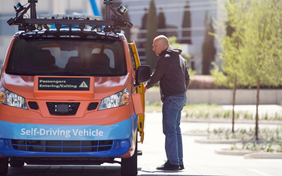 One of Drive.ai's distinctive orange vans being tested in San Francisco, showing its information screens to help pedestrians - Drive.ai