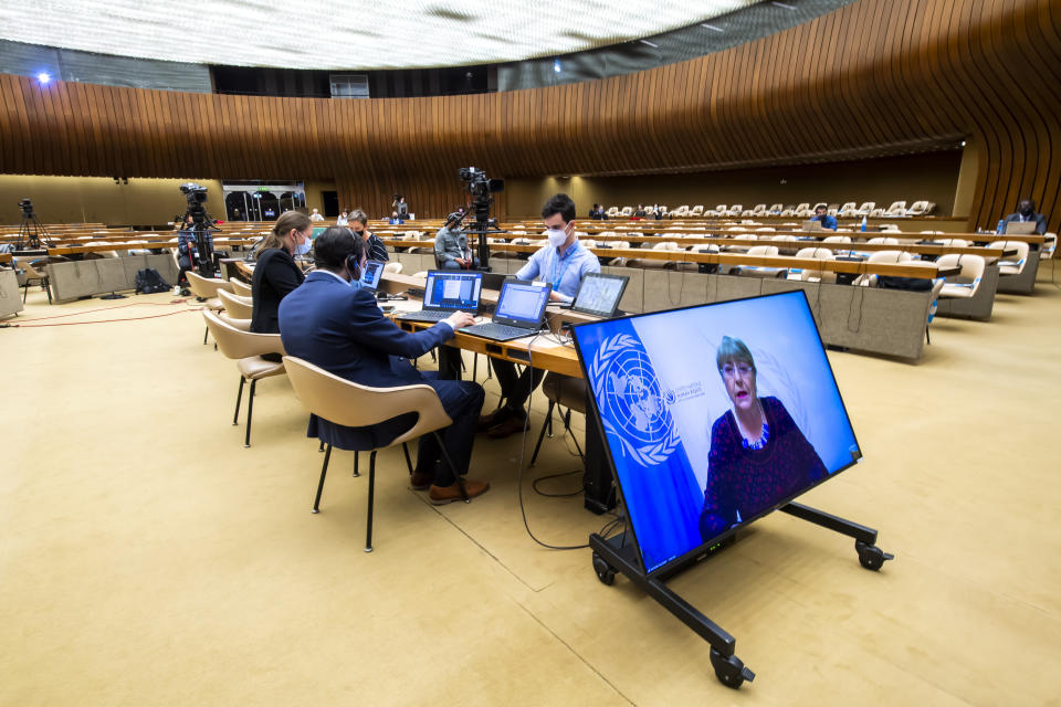 CORRECTING DATE TO 27 - UN High Commissioner for Human Rights Michelle Bachelet, is displayed on a screen as she delivers her speech during a special session of the UN Human Rights Council to discuss situation in the Occupied Palestinian Territory, at the European headquarters of the United Nations in Geneva, Switzerland, Thursday, May 27, 2021. (Martial Trezzini/Keystone via AP)