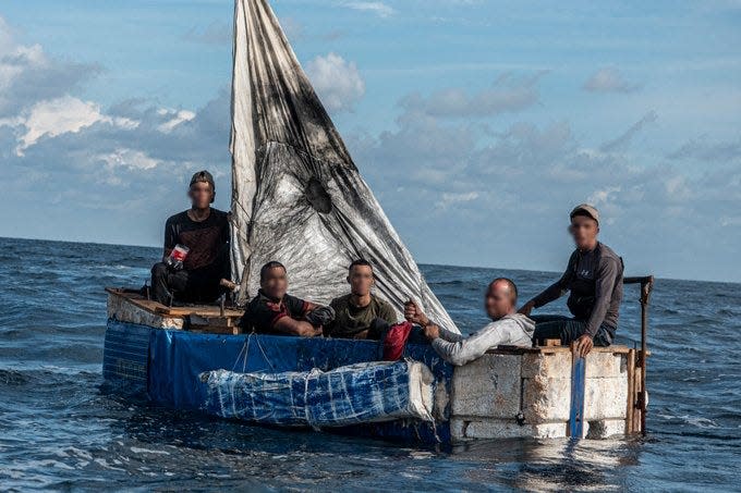 A makeshift boat carrying Cuban migrants is spotted by a U.S. Coast Guard cutter near Key West. More than 5,500 Cuban migrants have been interdicted at sea since October.