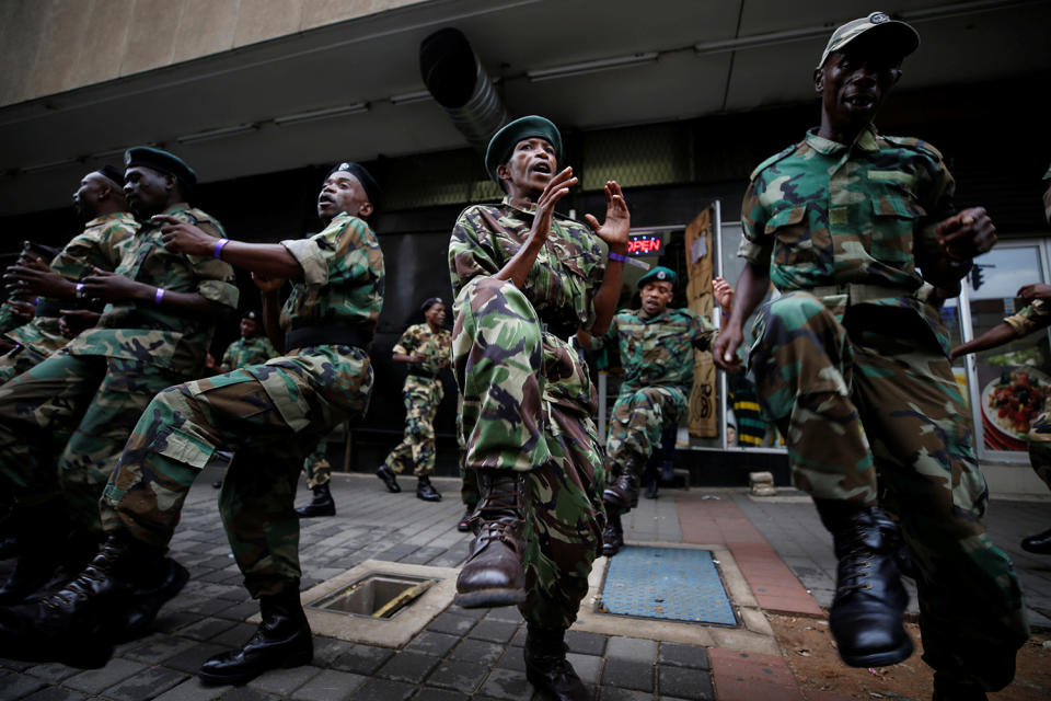 Supporters of the African National Congress wait for marchers outside ANC headquarters in Johannesburg