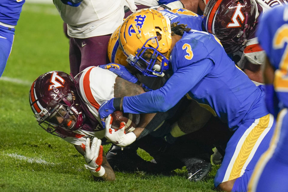 Pittsburgh defensive back Damar Hamlin (3) stops Virginia Tech quarterback Hendon Hooker (2) short of the goal line on fourth down during the second half of an NCAA college football game, Saturday, Nov. 21, 2020, in Pittsburgh. (AP Photo/Keith Srakocic)