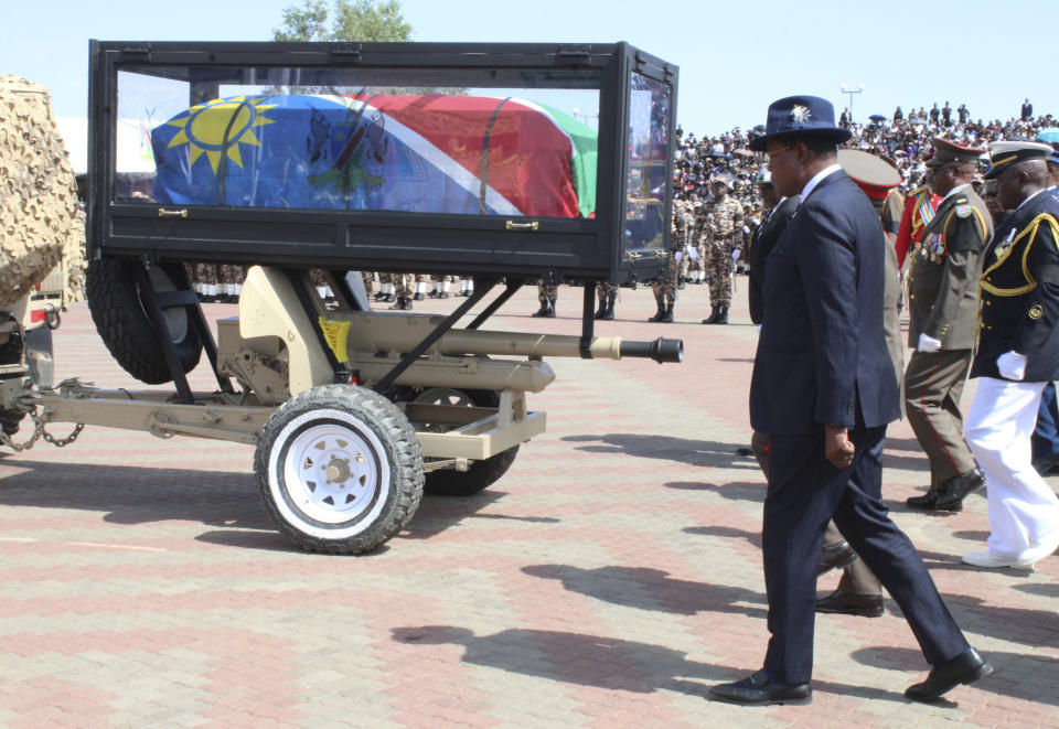 Mourners follow the flag-draped coffin of the late Namibian President Hage Geingob during his funeral service in Windhoek, Namibia, Sunday, Feb. 25, 2024. (AP Photo/Esther Mbathera)