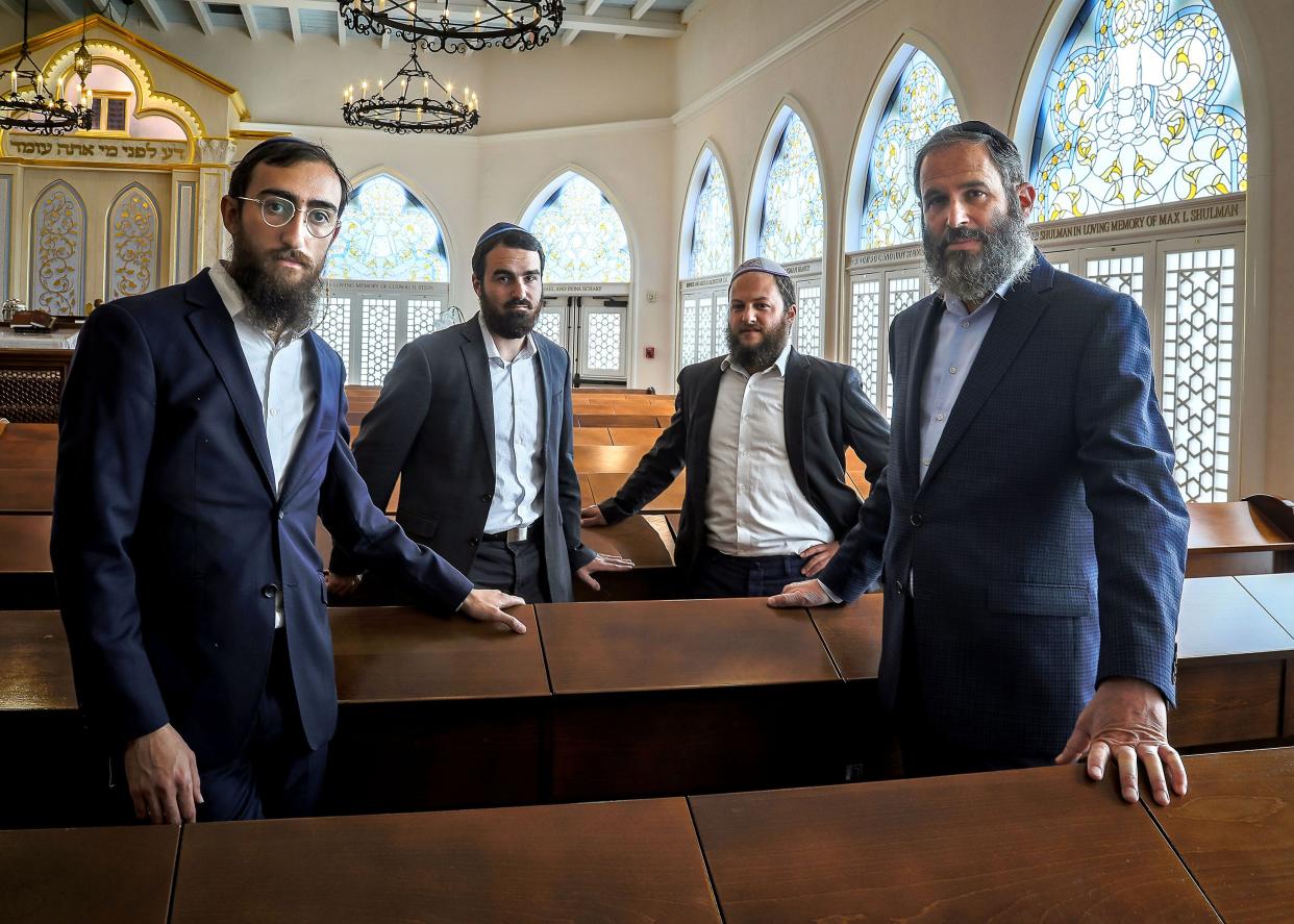 Rabbis Shneor Minsky, from left, Leibel Shmotkin, Yosef Rice, and Moshe Scheiner stand Thursday inside Palm Beach Synagogue. They will travel to Israel on Sunday to support those affected by the Hamas attacks.