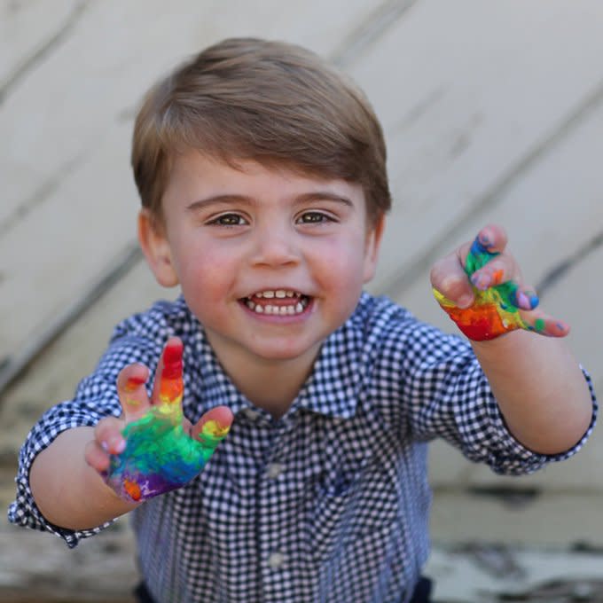 In his second birthday portraits, Louis is shown finger-painting rainbows. During the COVID-19 pandemic, children across the U.K. did so to support N.H.S workers.