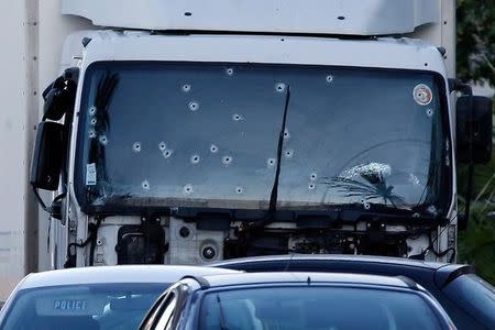 Bullet imacts are seen on the heavy truck that ran into a crowd at high speed killing scores celebrating the Bastille Day July 14 national holiday on the Promenade des Anglais killing 80 people in Nice, France, July 15, 2016. REUTERS/Eric Gaillard