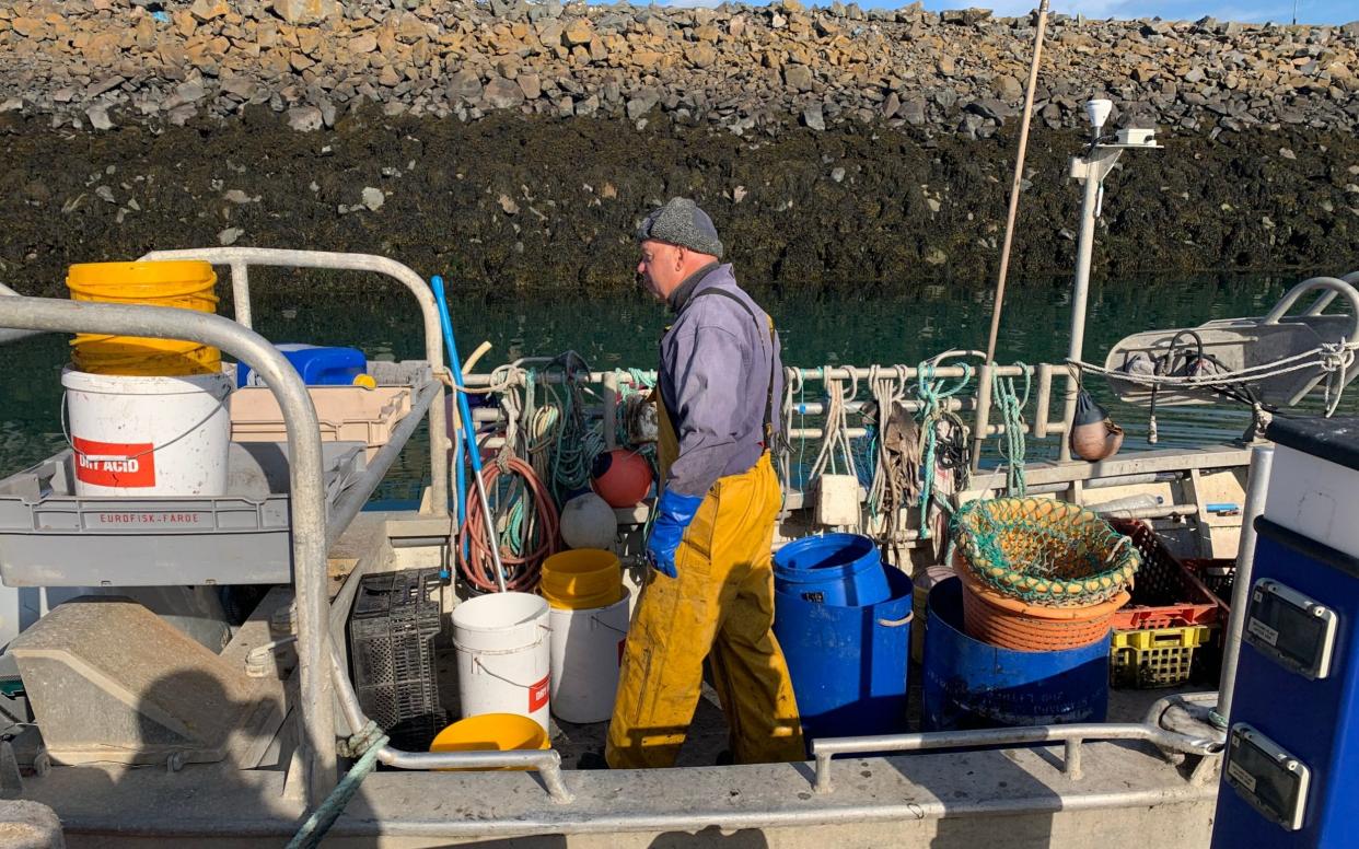 Leon Dessoude, a Jersey fisherman, on his boat on the east coast of the island - LIZZIE ROBERTS