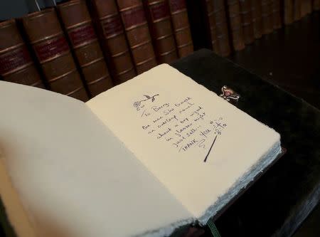 A copy of "The Tales of Beedle the Bard", handwritten and illustrated by Harry Potter author JK Rowling, is displayed at Sotheby's auction house in London, Britain December 8, 2016. REUTERS/Eddie Keogh
