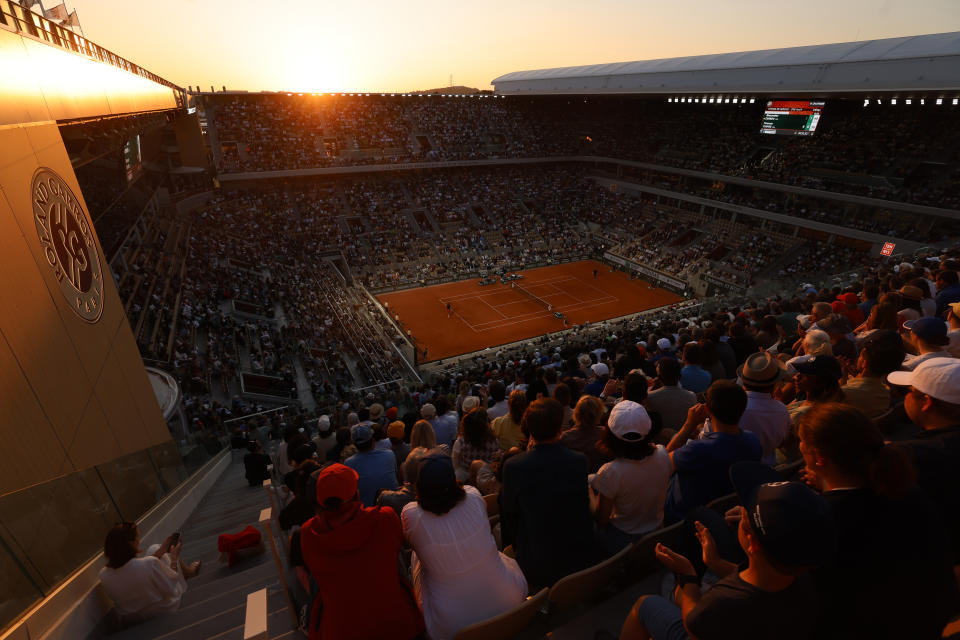 FILE - Spectators watch Frances Tiafoe of the U.S. playing against Germany's Alexander Zverev during their third round match of the French Open tennis tournament at the Roland Garros stadium in Paris, Saturday, June 3, 2023. The stadium will host the Paris 2024 tennis and boxing competitions. (AP Photo/Jean-Francois Badias, File)