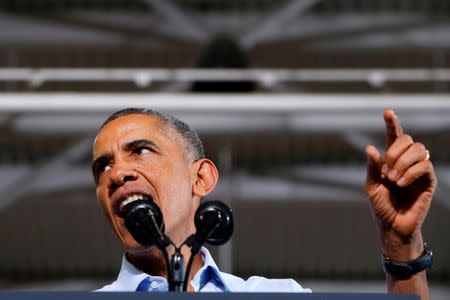 U.S. President Barack Obama campaigns for U.S. Representative Gary Peters (D-MI), candidate for U.S. Senate, and former U.S. Representative Mark Schauer (D-MI), candidate for governor of Michigan, at Wayne State University in Detroit, Michigan November 1, 2014. REUTERS/Jonathan Ernst