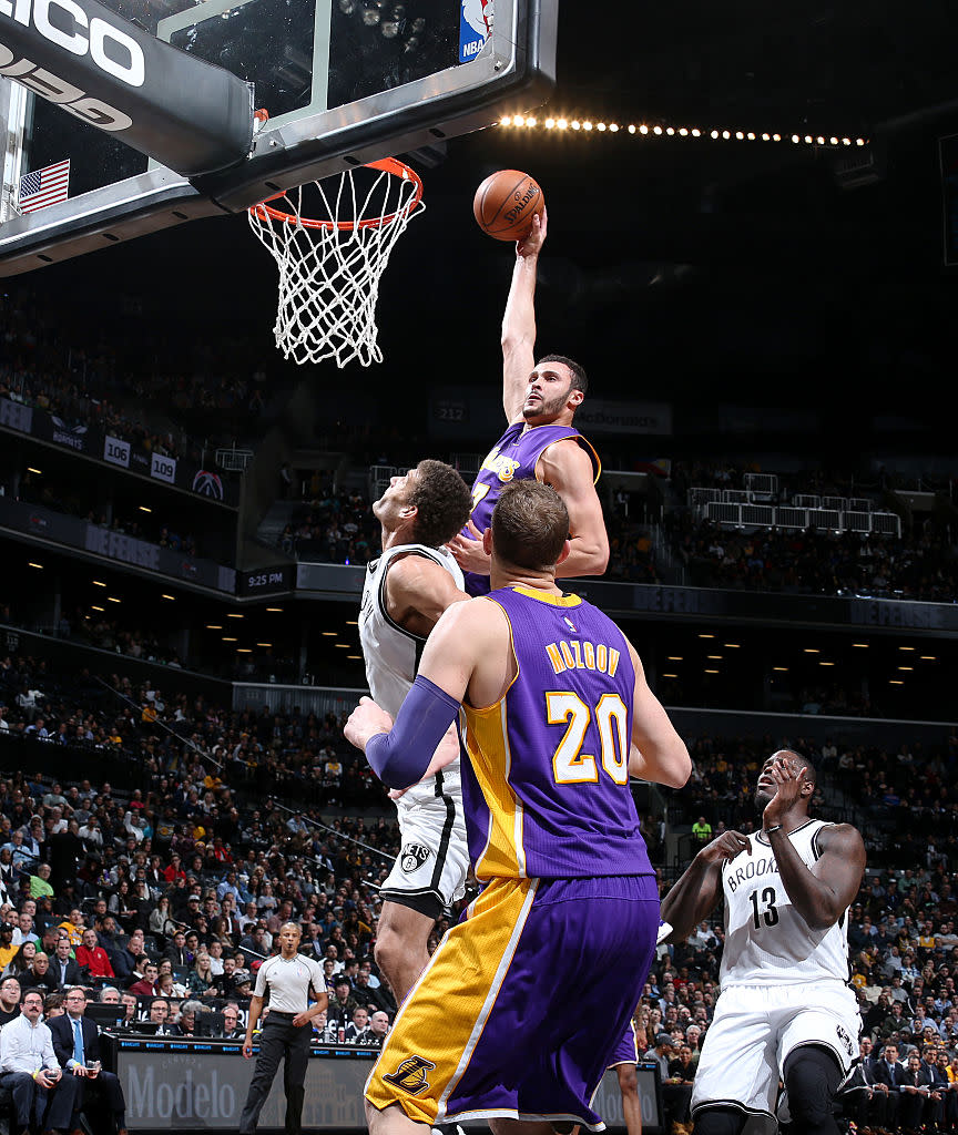 Brook Lopez can't believe that Larry Nance Jr. is still going up. (Nathaniel S. Butler/NBAE/Getty Images)