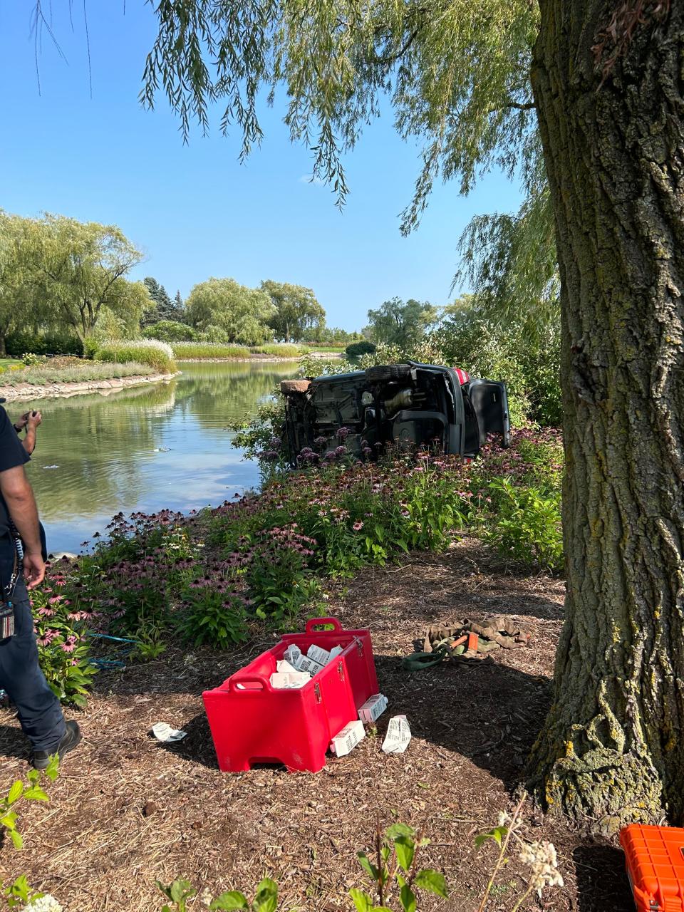 Scene at Acuity Insurance in Sheboygan after a man drove his vehicle off Interstate 43 and into a retention pond on the property Wednesday, Aug. 23, 2023.