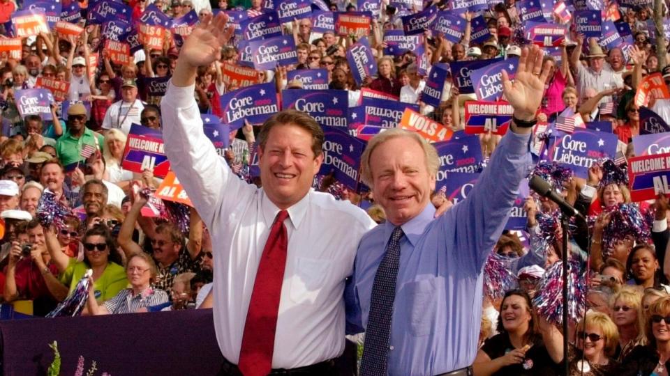 PHOTO: In this Oct. 25, 2000 file photo, Democratic presidential candidate Vice President Al Gore, left, and his running mate, vice presidential candidate Sen. Joe Lieberman wave to supporters at a campaign rally in Jackson, Tenn. (Stephan Savoia/AP, FILE)