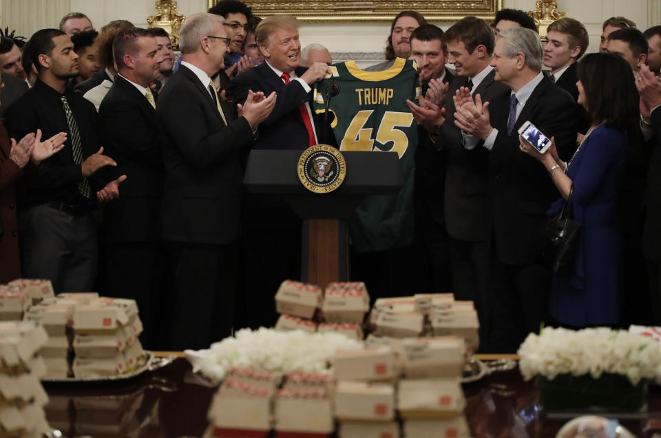 President Trump welcomes the North Dakota State Bison to the White House with fast food. (AP)