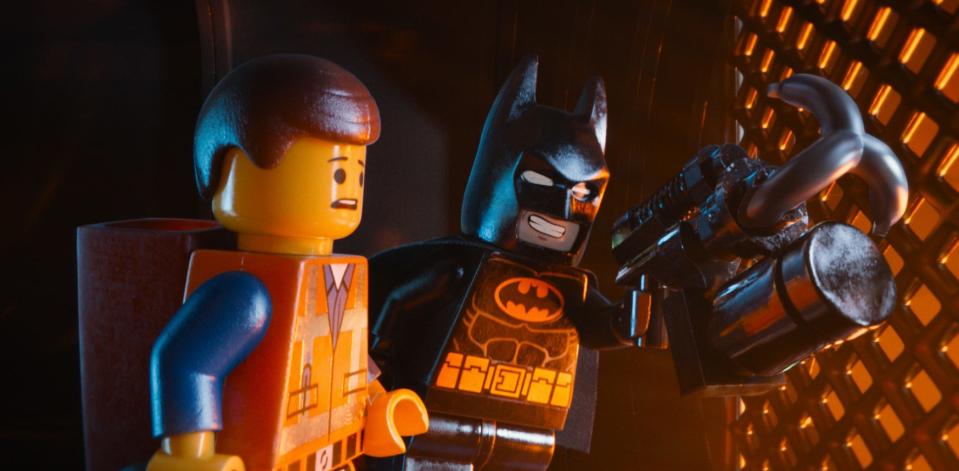 This image released by Warner Bros. Pictures shows characters Emmet, voiced by Chris Pratt, left, and Batman, voiced by Will Arnett, in a scene from "The Lego Movie."