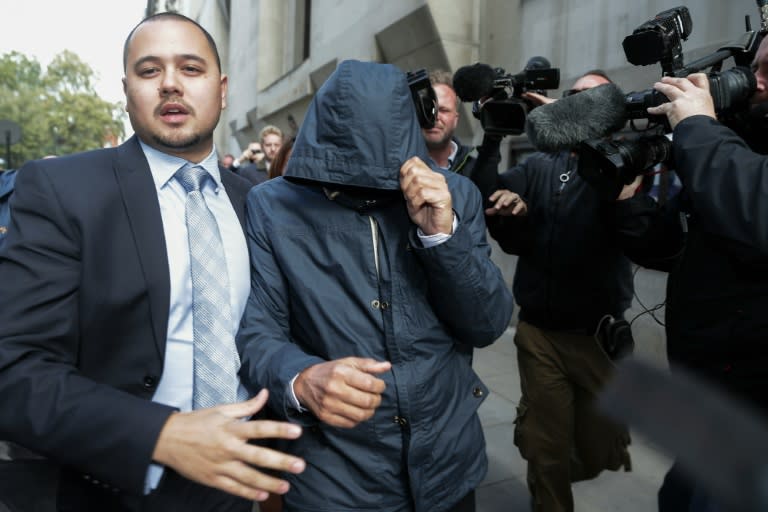 Mazher Mahmood (C), a British journalist known as the "Fake Sheikh", pictured leaving the Old Bailey Central Criminal Court in central London, on October 5, 2016
