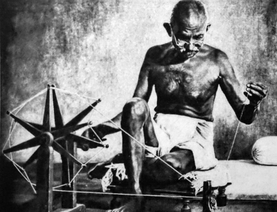 Mohandas Karamchand Gandhi with his charkha. (Photo by: Universal History Archive/ Universal Images Group via Getty Images)