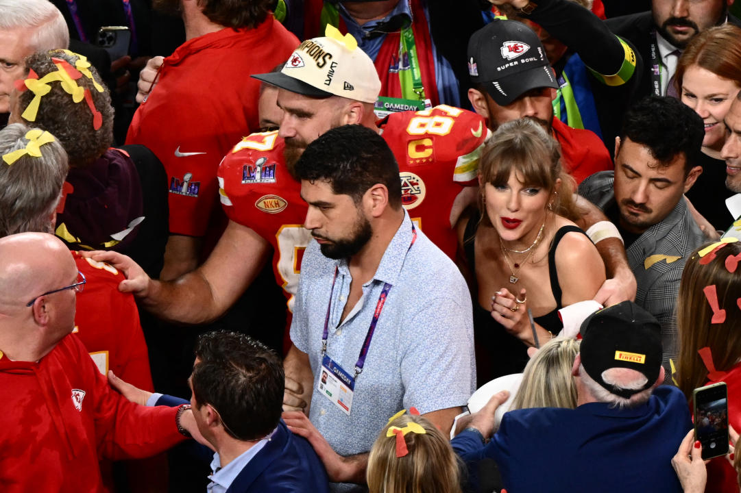 US singer-songwriter Taylor Swift hugs boyfriend Kansas City Chiefs' tight end #87 Travis Kelce after the Chiefs won Super Bowl LVIII against the San Francisco 49ers at Allegiant Stadium in Las Vegas, Nevada, February 11, 2024. (Photo by Patrick T. Fallon / AFP) (Photo by PATRICK T. FALLON/AFP via Getty Images)