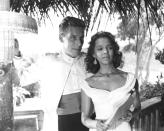 <p>Dorothy Dandridge sizzled in a pair of sapphire and silver earrings and choker while filming <em>Island in the Sun</em>. The jewelry was the perfect compliment to her bold, yellow sundress. </p>