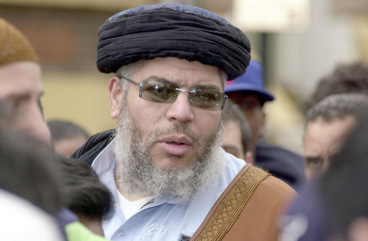 Abu Hamza answers questions from journalists after addressing an audience of more than a 100 muslims during lunchtime prayers outside Finsbury Park Mosque, north London.