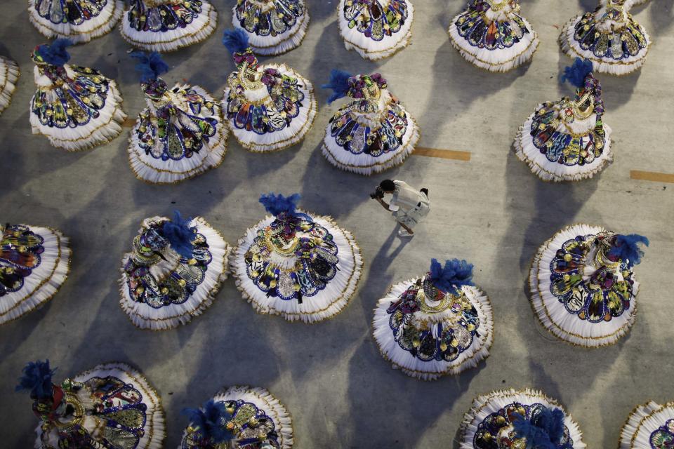 Dancers of Vila Isabel samba school parade during carnival celebrations at the Sambadrome in Rio de Janeiro, Brazil, Monday Feb.  20, 2012.   Millions watched the sequin-clad samba dancers at Rio de Janeiro's iconic Carnival parade.  (AP Photo/Felipe Dana)