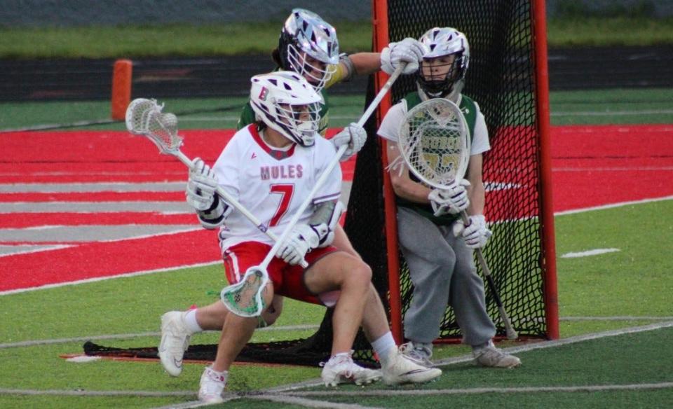 Brennan McIntire moves in on goal during Bedford's 16-6 win over Ann Arbor Huron on Friday, May 10, 2024 that clinched at least a share of the Southeastern Conference championship.