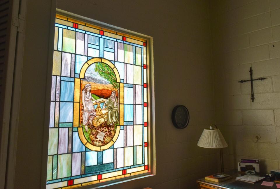 The lone remaining stained-glass window in the Chapel of the Cross Episcopal Church was only recently installed.
