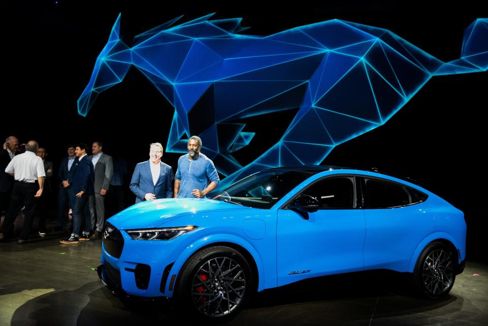 Actor Idris Elba and Bill Ford, executive chairman of Ford Motor Co., introduce the all-electric Mustang Mach-E SUV in November 2019 in Los Angeles, California.