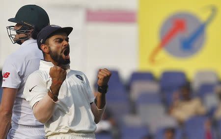 India's captain Virat Kohli celebrates after their win over South Africa on the third day of their third test cricket match in Nagpur, India, November 27, 2015. REUTERS/Amit Dave