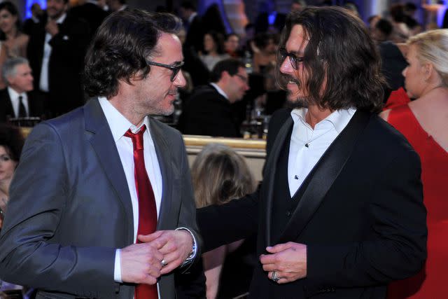 <p> Vince Bucci/NBCU Photo Bank/NBCUniversal via Getty </p> Robert Downey Jr. and Johnny Depp on Jan. 16, 2011