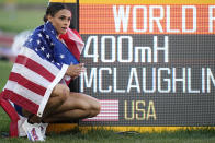 Gold medalist Sydney McLaughlin, of the United States, poses by a sign after winning the final of the women's 400-meter hurdles at the World Athletics Championships on Friday, July 22, 2022, in Eugene, Ore. (AP Photo/Ashley Landis)