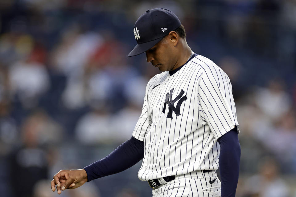 New York Yankees pitcher Jhony Brito walks off the field after being removed during the first inning of the team's baseball game against the Minnesota Twins on Thursday, April 13, 2023, in New York. (AP Photo/Adam Hunger)