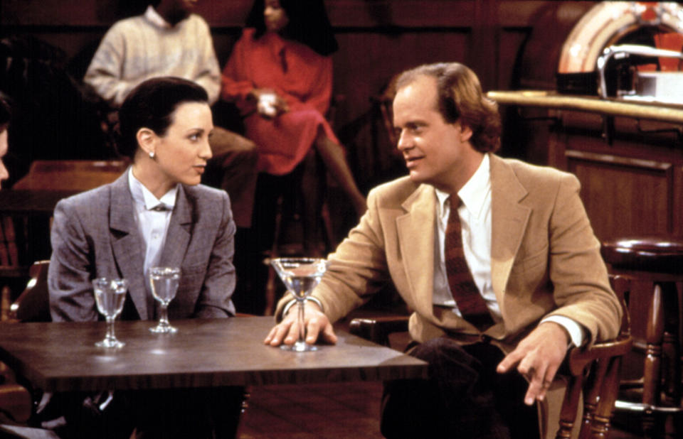 Frasier and Lilith having a drink in "Cheers"