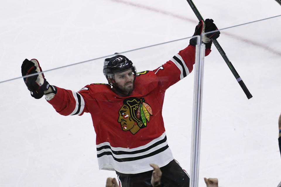 Chicago Blackhawks center Jason Dickinson celebrates after scoring a goal during the second period of the team's NHL hockey game against the Los Angeles Kings, Thursday, Nov. 3, 2022, in Chicago. (AP Photo/Matt Marton)