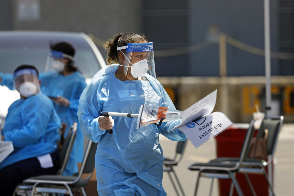 An Orange County testing site at the Anaheim Convention Center. Clinicians from 360 Clinic are administering the test kits, but citizens will do their own sample taking. (Carolyn Cole/Los Angeles Times)