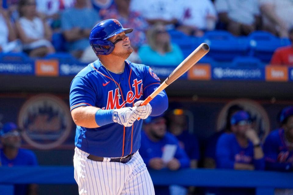 New York Mets designated hitter Daniel Vogelbach watches his two-run double during a spring training game against the Washington Nationals on Sunday, Feb. 26, 2023, in Port St. Lucie, Fla. (AP Photo/Jeff Roberson)