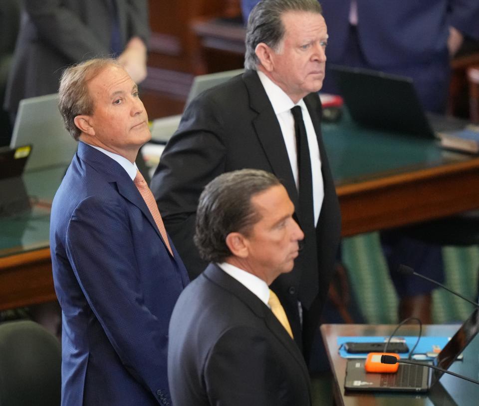Attorney General Ken Paxton, middle, with his attorneys Tony Buzbee and Dan Cogdell at his impeachment trial at the Capitol on Tuesday September 5, 2023.