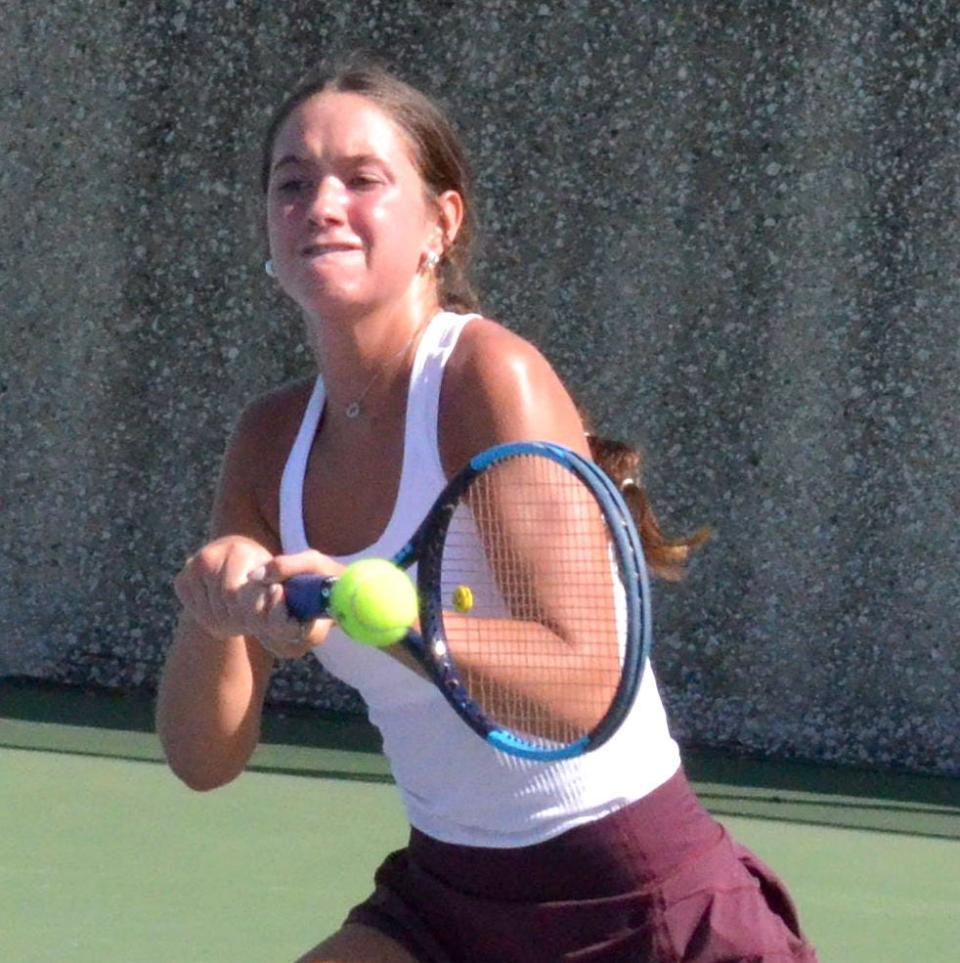 Holland Christian's Kayla VandenBerg returns a shot during the OK Blue Conference finals on Friday at Holland Christian.