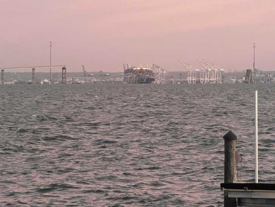 Baltimore’s Francis Scott Key Bridge collapse is shown early morning, Tuesday, March 26, 2024 from Riviera Beach, Md. A container ship rammed into a major bridge in Baltimore early Tuesday, causing it to snap in a few places and plunge into the river below. Several vehicles fell into the chilly waters, and rescuers were initially searching for at least seven people. (AP Photo/Nathan Ellgren)