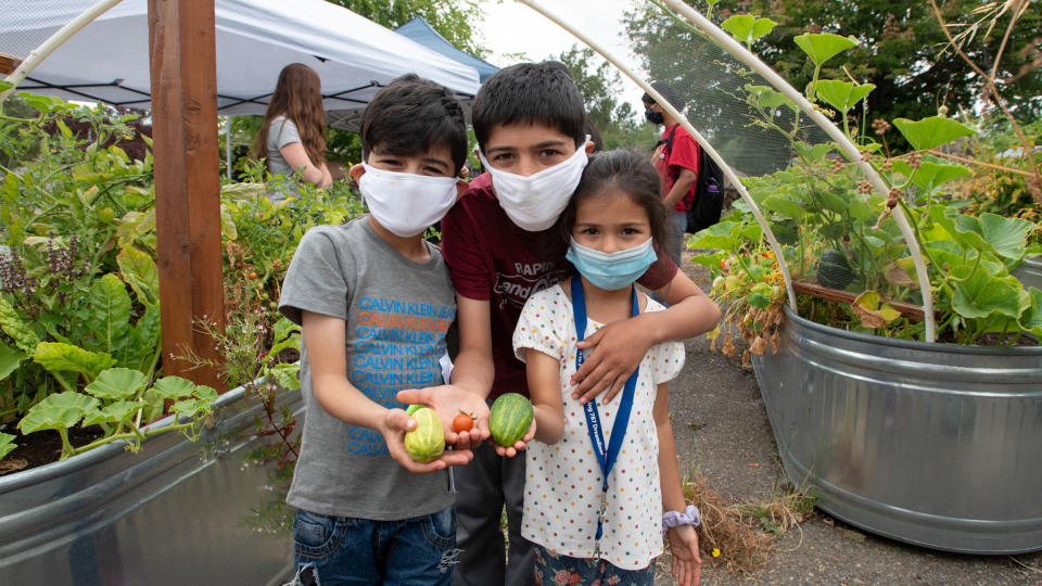 Children learn at a community summer camp in Paradise Parking Plots.  (Hannah Letinich)