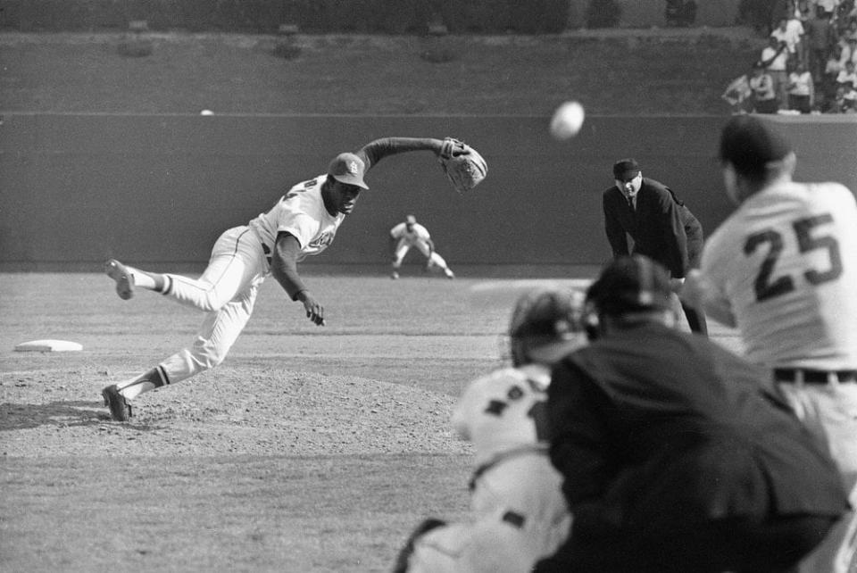 In this Oct. 2, 1968, file photo, St. Louis Cardinals ace pitcher Bob Gibson throws to Detroit Tigers’ Norm Cash during the ninth inning of Game 1 of the baseball World Series at Busch Stadium in St. Louis. (AP Photo, File)