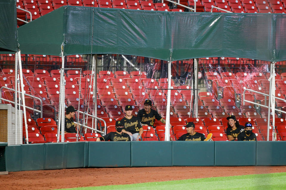 ST. LOUIS, MO - JULY 24: Members of the Pittsburgh Pirates watch the Opening Day game against the St. Louis Cardinals from the extended dugout at Busch Stadium on July 24, 2020 in St. Louis, Missouri. The 2020 season had been postponed since March due to the COVID-19 pandemic. (Photo by Scott Kane/Getty Images)