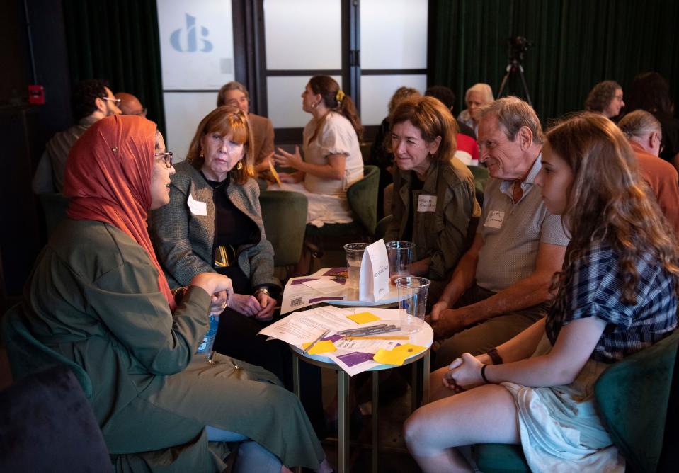 People are put into groups and converse during Millions of Conversations’ event Conversation of Grief, Healing and Hope, at AnzieBlue in Nashville, Tenn., Thursday, Oct. 26, 2023.