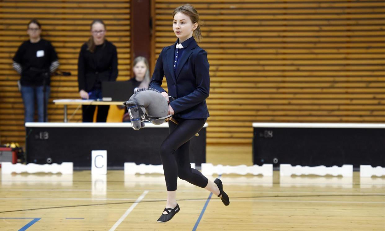 <span>Ella Holm and hobby horse Fede compete during the Finnish hobby horsing championships in Vantaa, April 2017.</span><span>Photograph: Heikki Saukkomaa/AP</span>