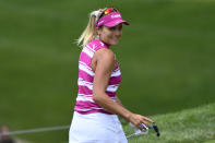 Lexi Thompson smiles after her putt on the 15th green during the third round in the Women's PGA Championship golf tournament at Congressional Country Club, Saturday, June 25, 2022, in Bethesda, Md. (AP Photo/Terrance Williams)
