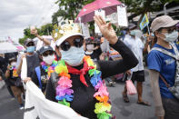 A pro-democracy supporter shows the three-finger salute of defiance during a demonstration in Bangkok, Thailand, Thursday, June 24, 2021. Anti-government protests expected to resume in Bangkok after a long break due partly to a surge in COVID-19 cases. Gatherings are planned for several locations across the capital, despite health officials mulling a week-long lockdown in Bangkok to control a rampant virus surge. (AP Photo/Sakchai Lalit)
