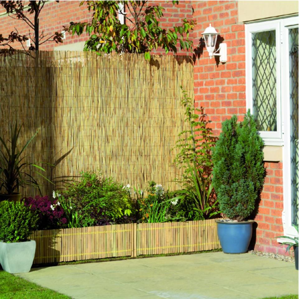 24. Boost privacy with tall reed screens