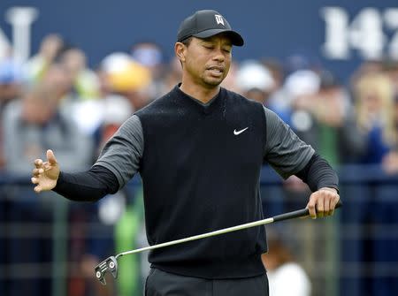 Jul 20, 2018; Carnoustie, SCT; Tiger Woods reacts to his putt on the 18th green during the second round of The Open Championship golf tournament at Carnoustie Golf Links. Mandatory Credit: Ian Rutherford-USA TODAY Sports