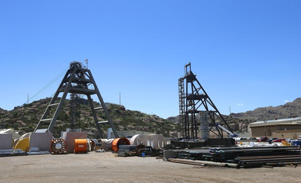 FILE - Equipment stands around the Resolution Copper Mining area Shaft #9, right, and Shaft #10, left, that awaits the expansion go ahead in Superior, Ariz., June 15, 2015. A federal agency says an environmental review for a proposed copper mine in Arizona falls short on details about water and the potential impacts of climate change. (AP Photo/Ross D. Franklin, File)