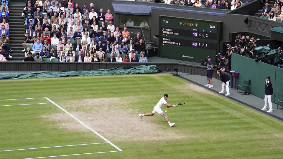 Novak Djokovic in action against Lorenzo Musetti in the semifinals on Friday. - John Walton/PA/AP