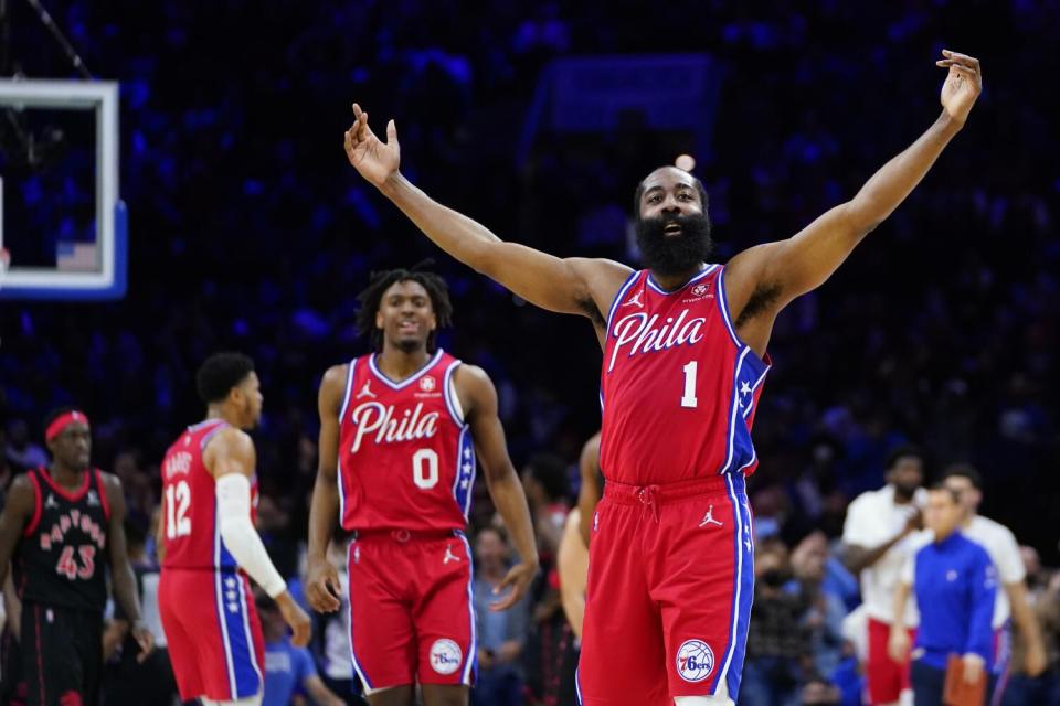 Philadelphia's James Harden throws his hands out as he reacts to making a shot.